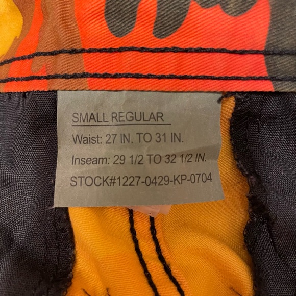Rothco orange, yellow, and black military cargo pants. - Picture 2 of 4